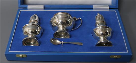 A cased modern silver three piece condiment set by Garrard & Co, London, 1993.